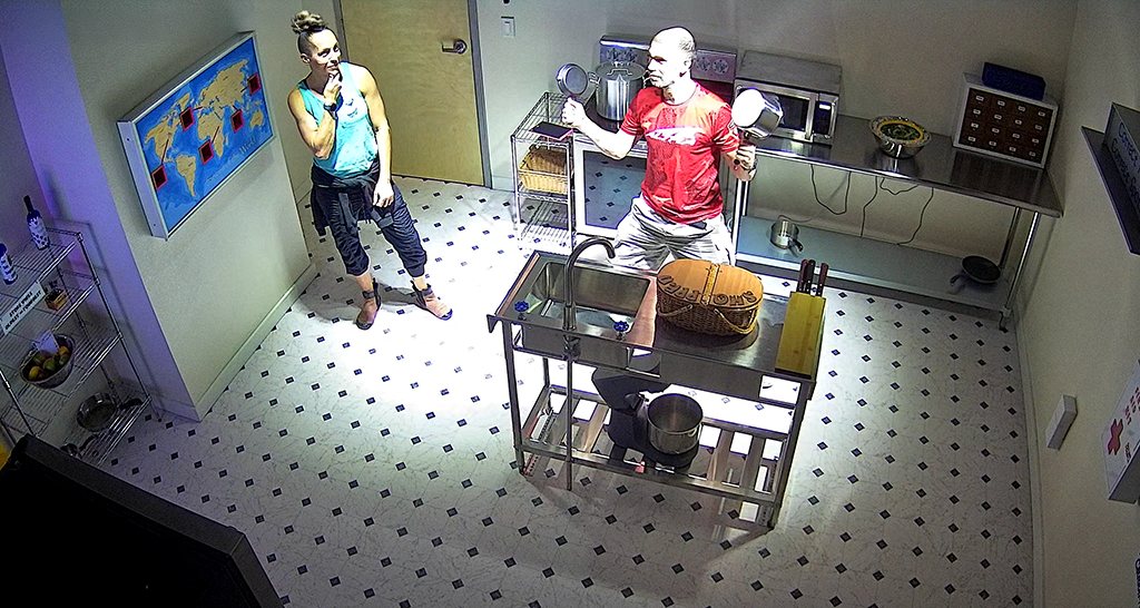 Two players working on puzzles at the prep station during a Kitchen Chaos game